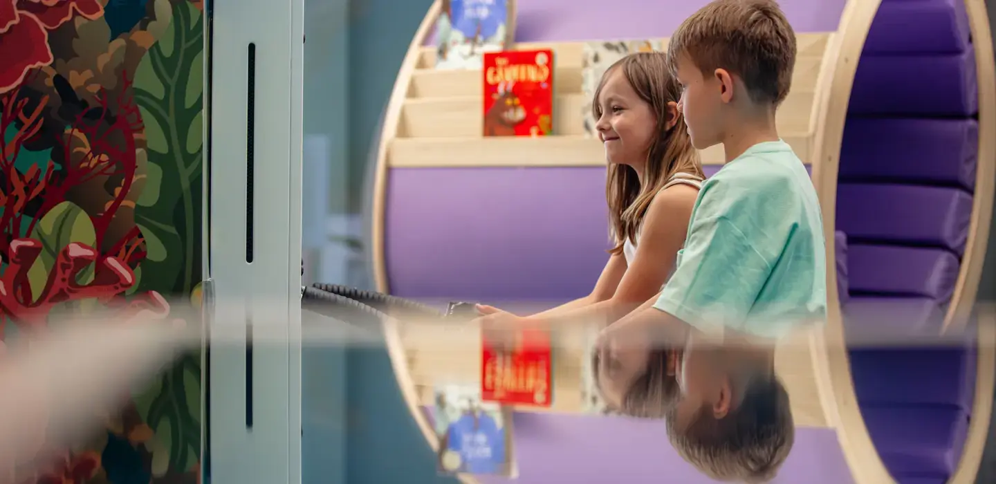Kids playing interactive games in Centara Mirage Beach Resort Dubai