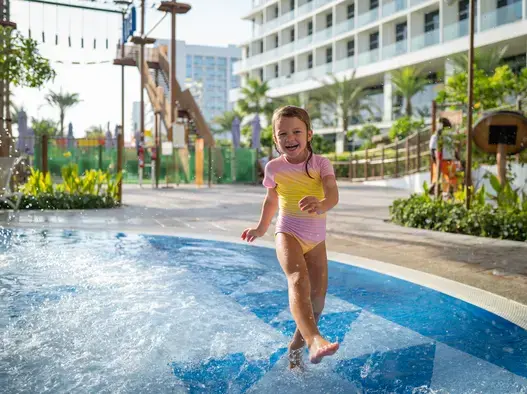 A girl at splash pad centara mirage beach resort dubai