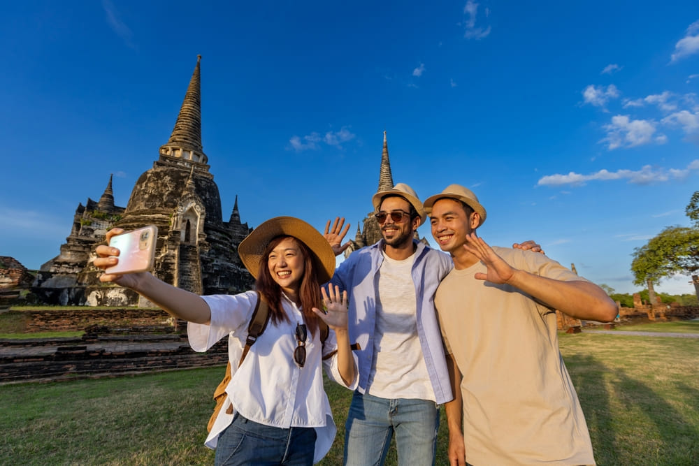 Tourists taking a group photo at one of the Ayutthaya temples